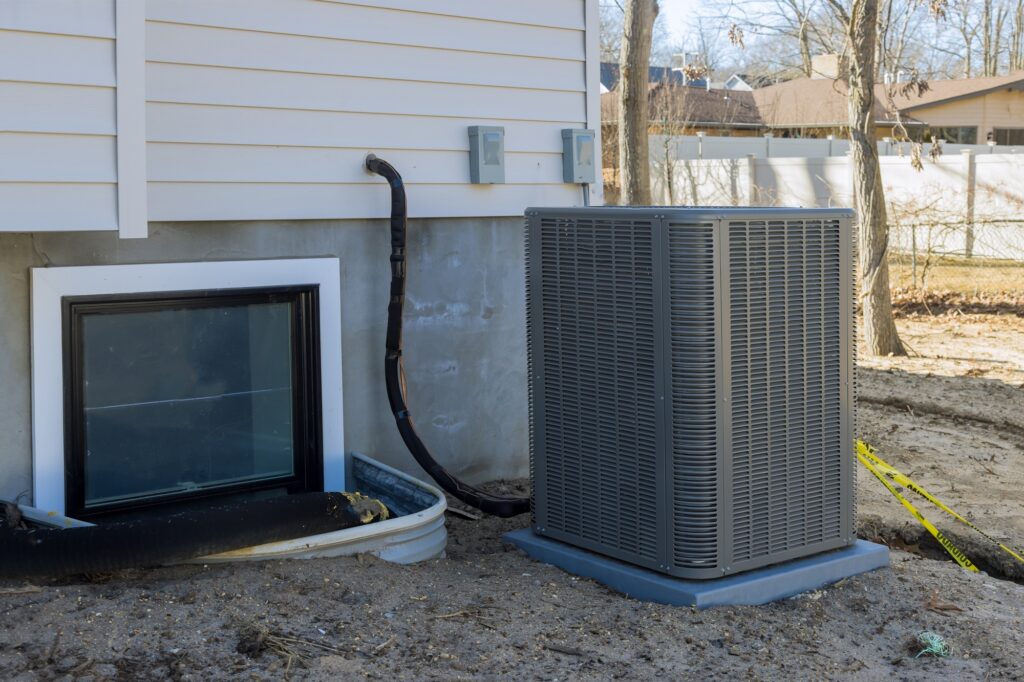 Air conditioning unit installed outside a house, showcasing HVAC system setup, emphasizing comfort and efficiency in San Diego's climate.